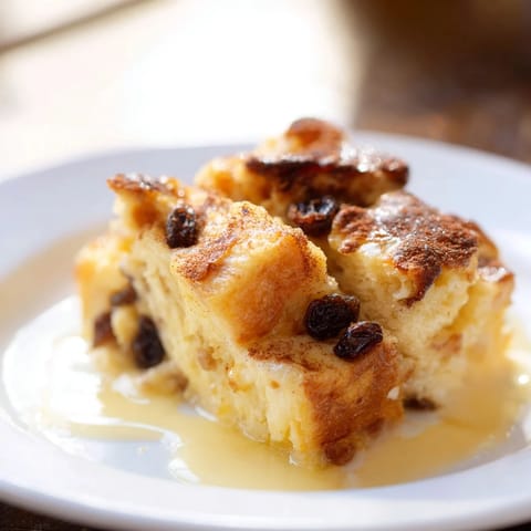 Imagine warm, spiced bread pudding with plump raisins, arriving fresh from the oven, ready to serve.