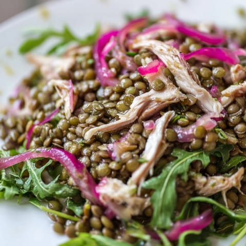 This vibrant Lentil & Chicken Spring Salad shows tender lentils and juicy chicken atop peppery greens with tangy onions.  