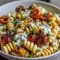 Creamy Mexican Street Corn Elote Pasta Salad with charred corn and cotija cheese.