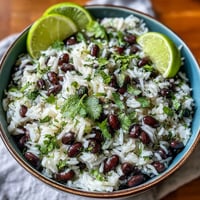 Fresh Coconut Lime Rice with Black Beans and cilantro, a vibrant side dish.